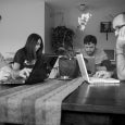 PRE Editors hunched over their "microcomputers"